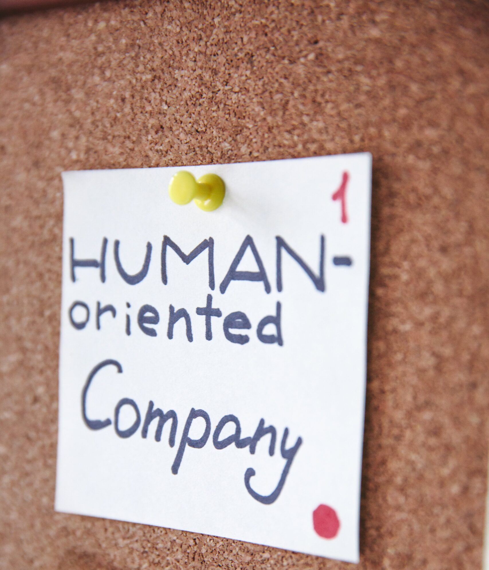 pin of label that says human-orienteed company